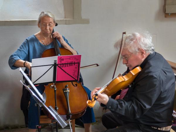 A Cellist and Violinist providing music for the event.
